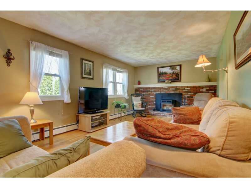 697 Lower River Road Lincoln, RI 02865 - Photo 3 of 25 Living Room. LIVING ROOM HAS WOOD BURNING FIREPLACE BUT HAS A PELLET STOVE INSERT