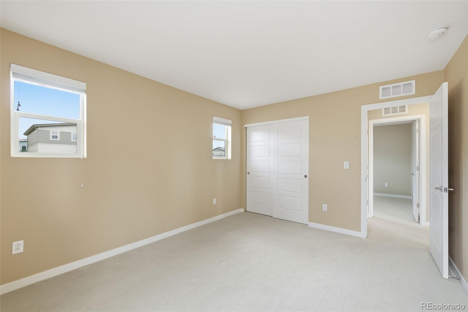 9602 Dunning Circle Highlands Ranch, CO 80126 - Photo 39 of 50 an empty room with windows and closet