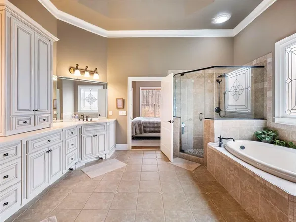 a bedroom with a bed and a ceiling fan