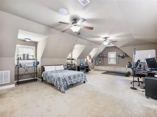 a living room with furniture and large windows