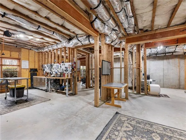 a view of a livingroom with furniture and a window