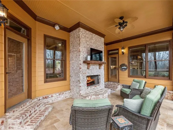 a view of a house with backyard porch and sitting area