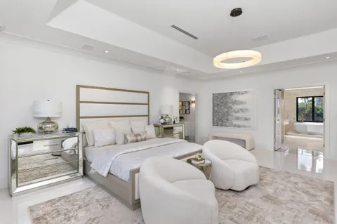 a view of a swimming pool with a lawn chairs