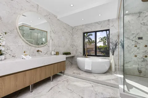 a swimming pool with outdoor seating and yard