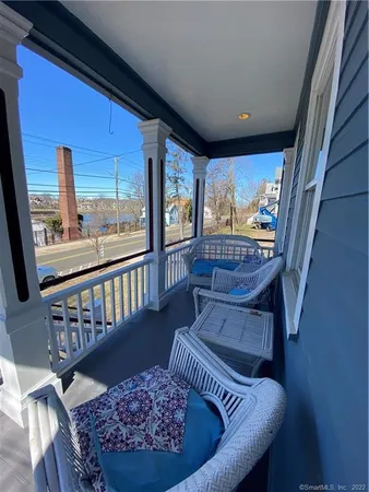 a view of a porch with furniture