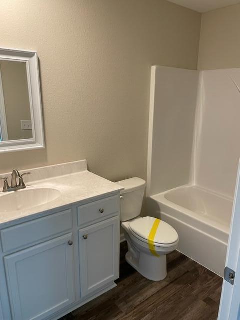 952 Mapoles Street Crestview, FL 32536 - Photo 11 of 23 a bathroom with a granite countertop toilet a sink and a bathtub