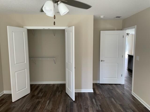 952 Mapoles Street Crestview, FL 32536 - Photo 12 of 23 a view of empty room with wooden floor and entryway
