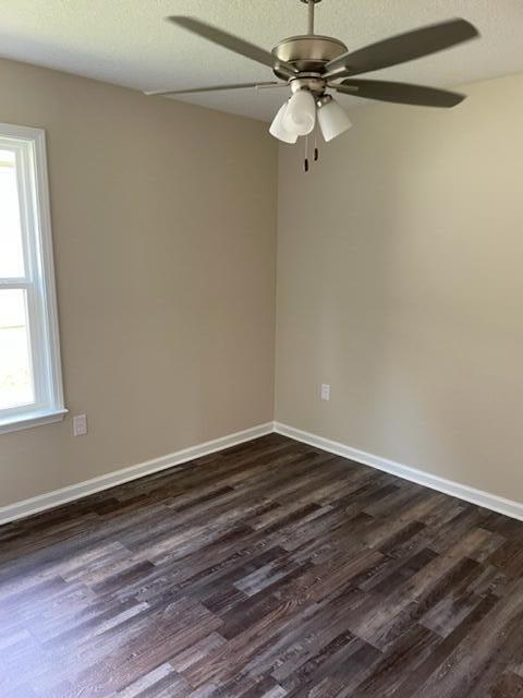 952 Mapoles Street Crestview, FL 32536 - Photo 17 of 23 a view of a room with wooden floor a ceiling fan and window