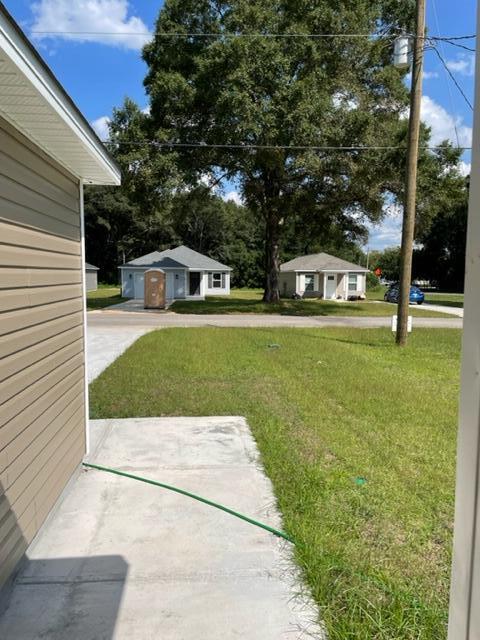 952 Mapoles Street Crestview, FL 32536 - Photo 3 of 23 a backyard of a house with table and chairs