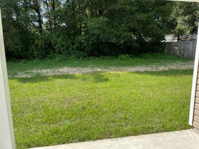 952 Mapoles Street Crestview, FL 32536 - Photo 5 of 23 a view of a green yard