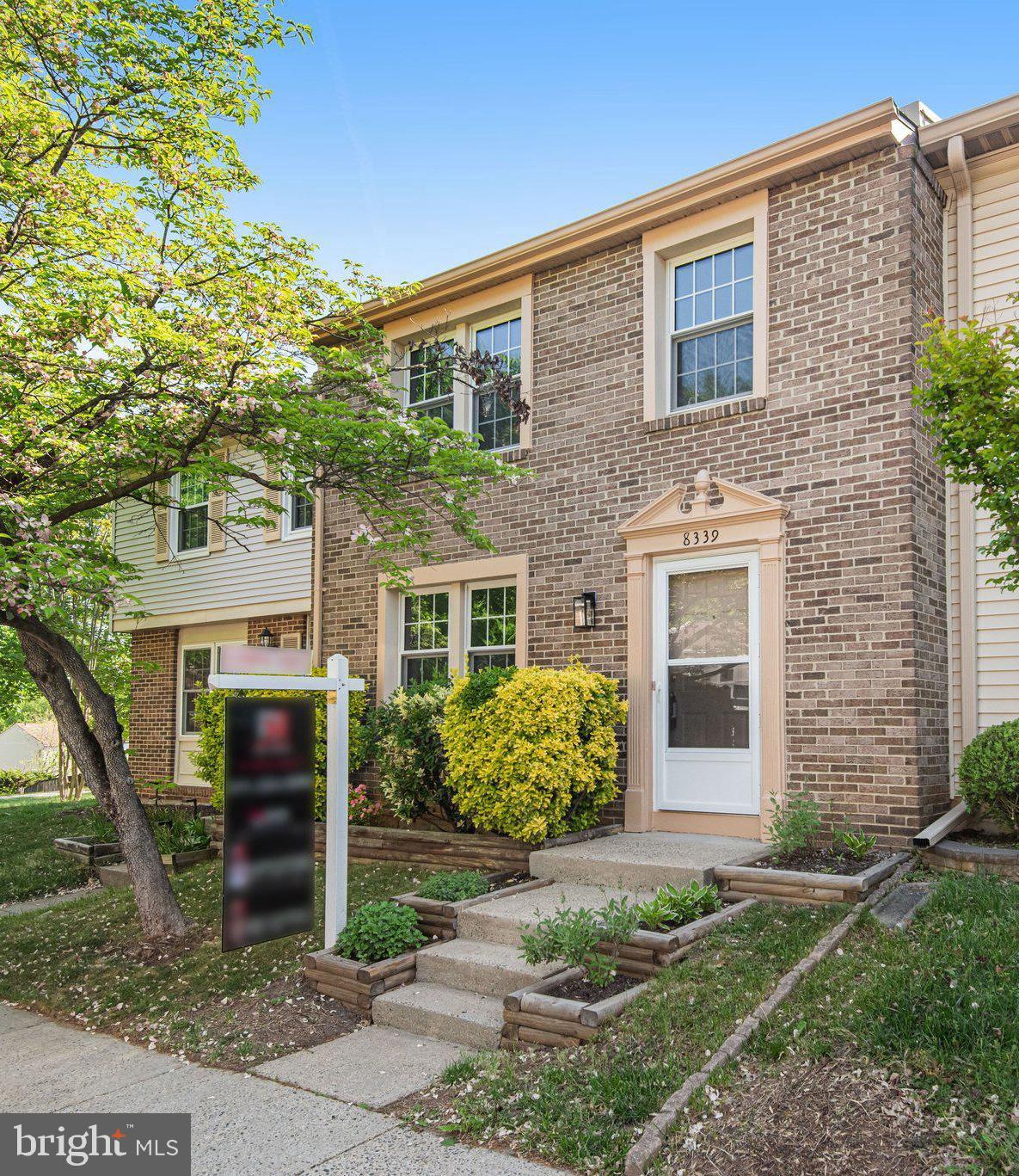 8339 Bark Tree Court Springfield, VA 22153 - Photo 2 of 23 front view of a brick house with a yard