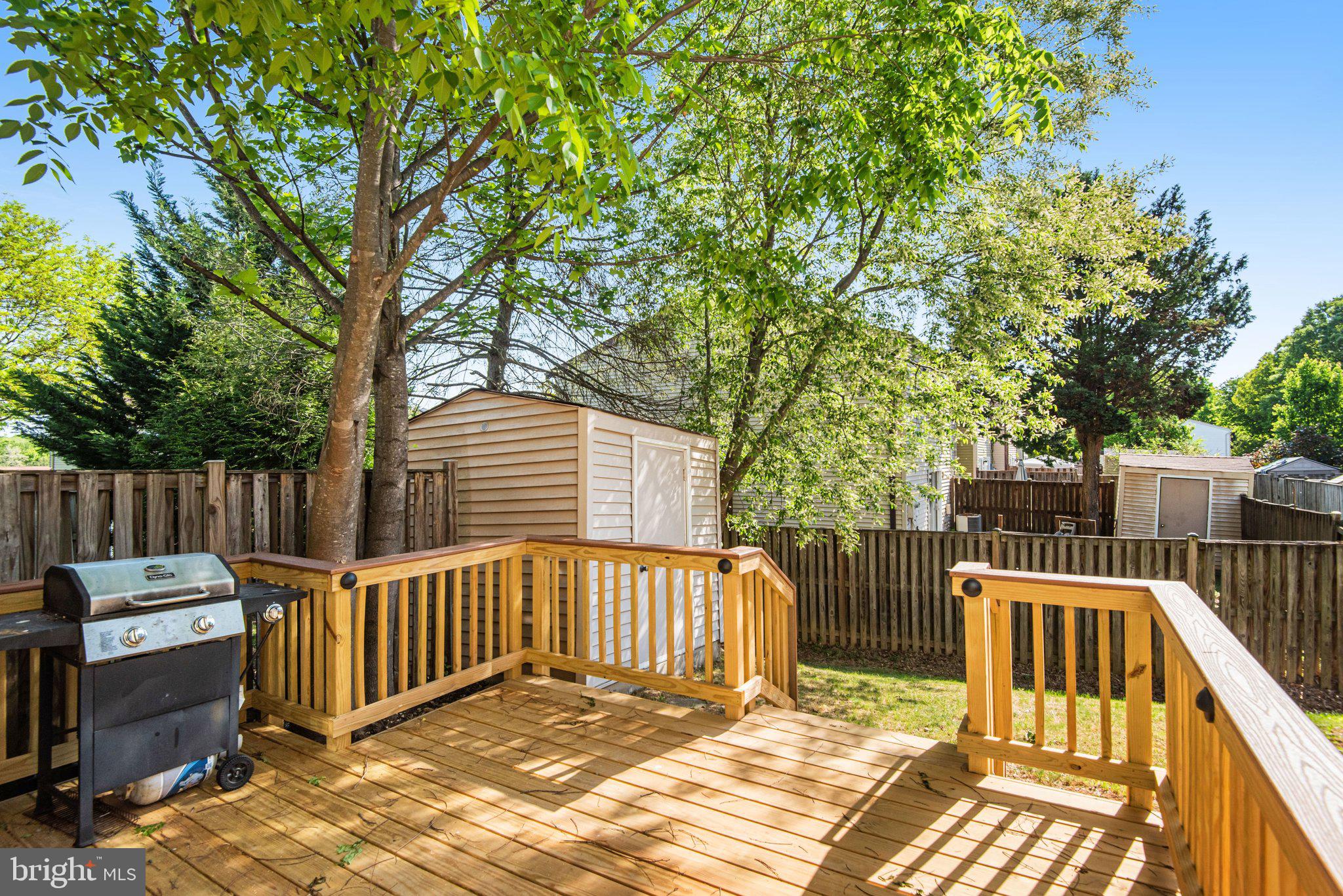 8339 Bark Tree Court Springfield, VA 22153 - Photo 21 of 23 a view of a wooden deck and a backyard