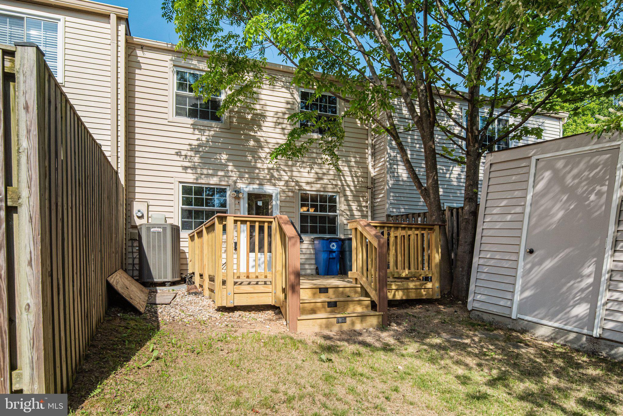 8339 Bark Tree Court Springfield, VA 22153 - Photo 22 of 23 a view of a house with wooden fence