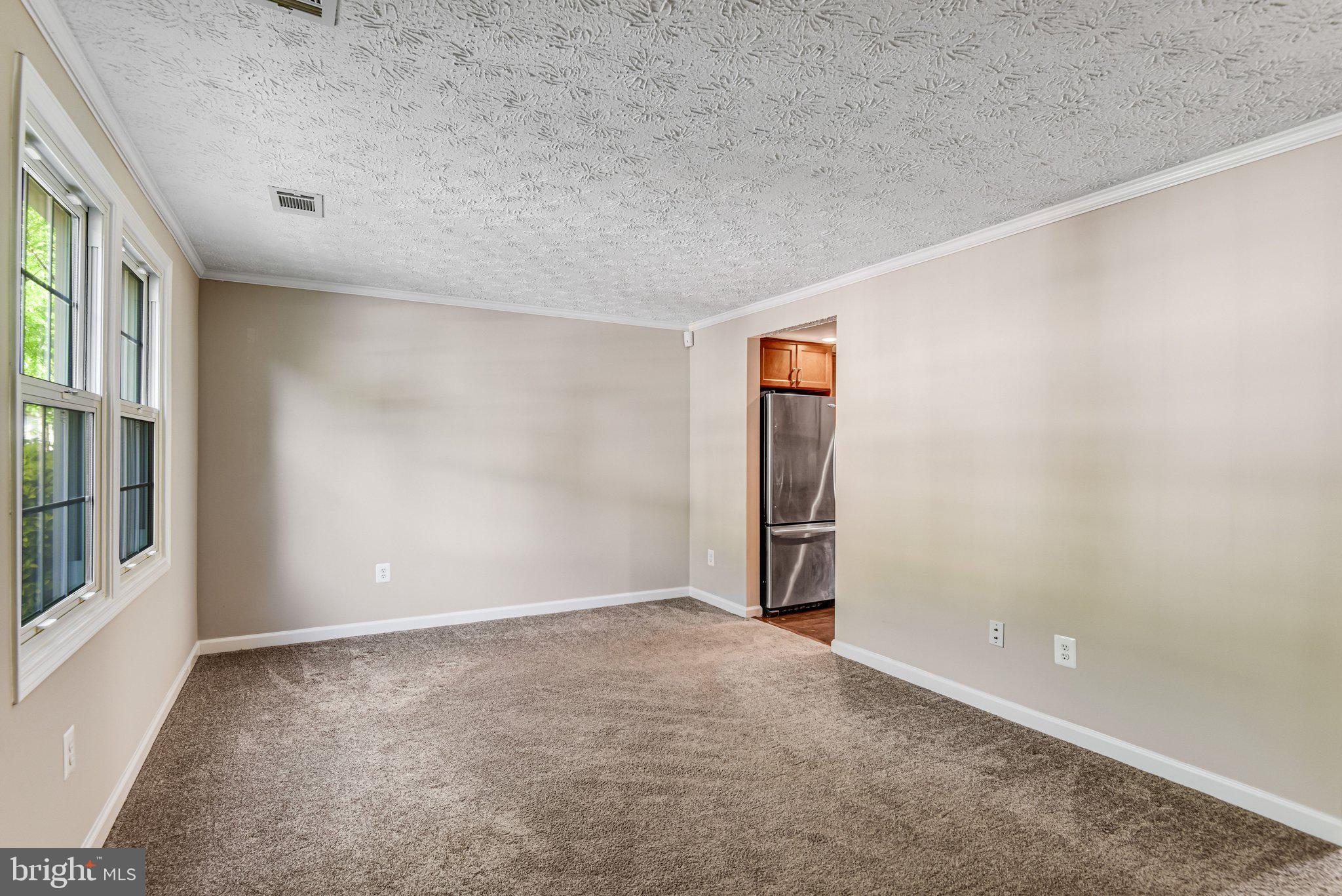 8339 Bark Tree Court Springfield, VA 22153 - Photo 4 of 23 an empty room with windows