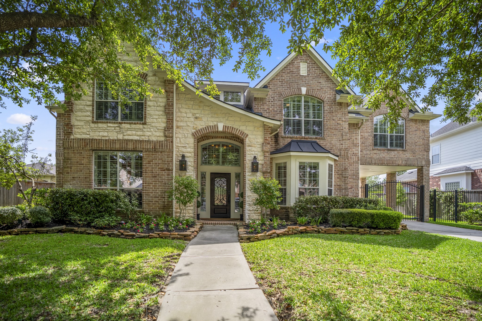 9707 Blue Cruls Way Spring, TX 77379 - Photo 9 of 50 a front view of a house with a yard