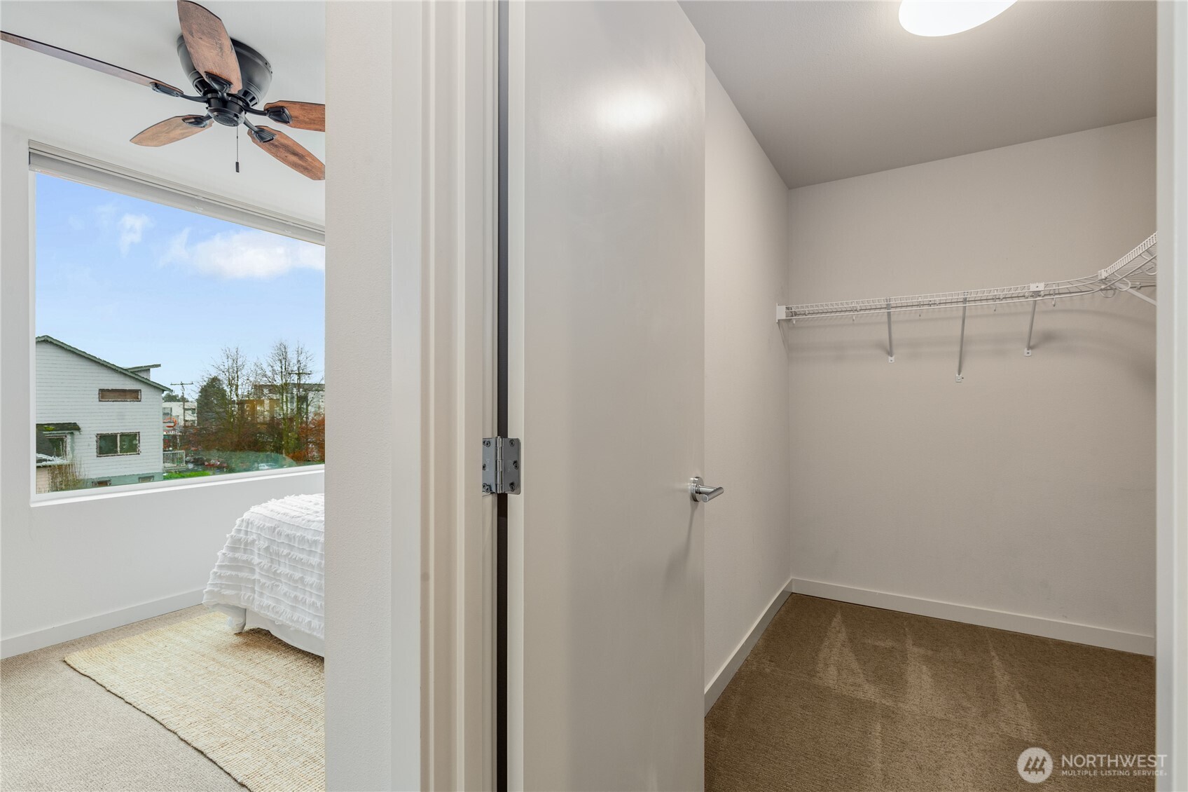 4272 Southwest Bradford Street Seattle, WA 98116 - Photo 22 of 28 a walk in closet and view of a bathroom