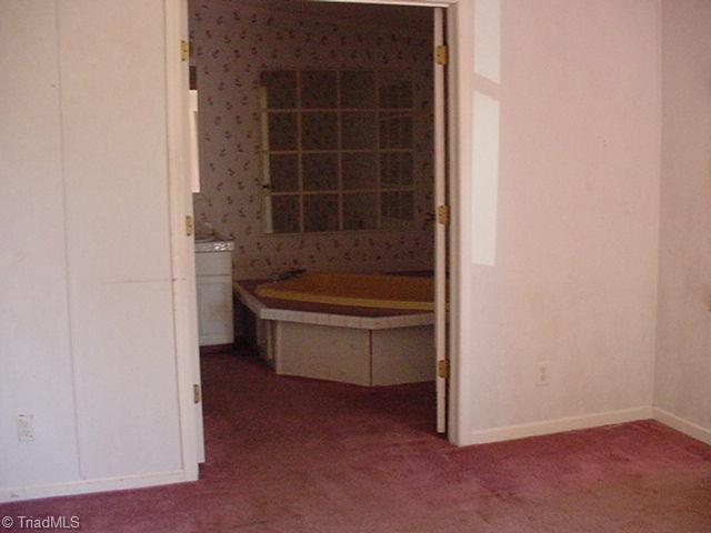 7705 Pine Street Rural Hall, NC 27045 - Photo 14 of 15 Master bedroom
