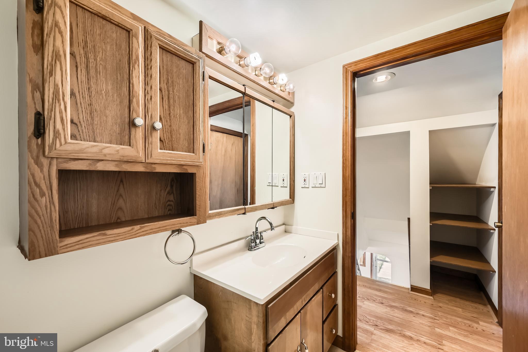 3169 Baybriar Road Baltimore, MD 21222 - Photo 20 of 28 a bathroom with a sink a vanity and a mirror