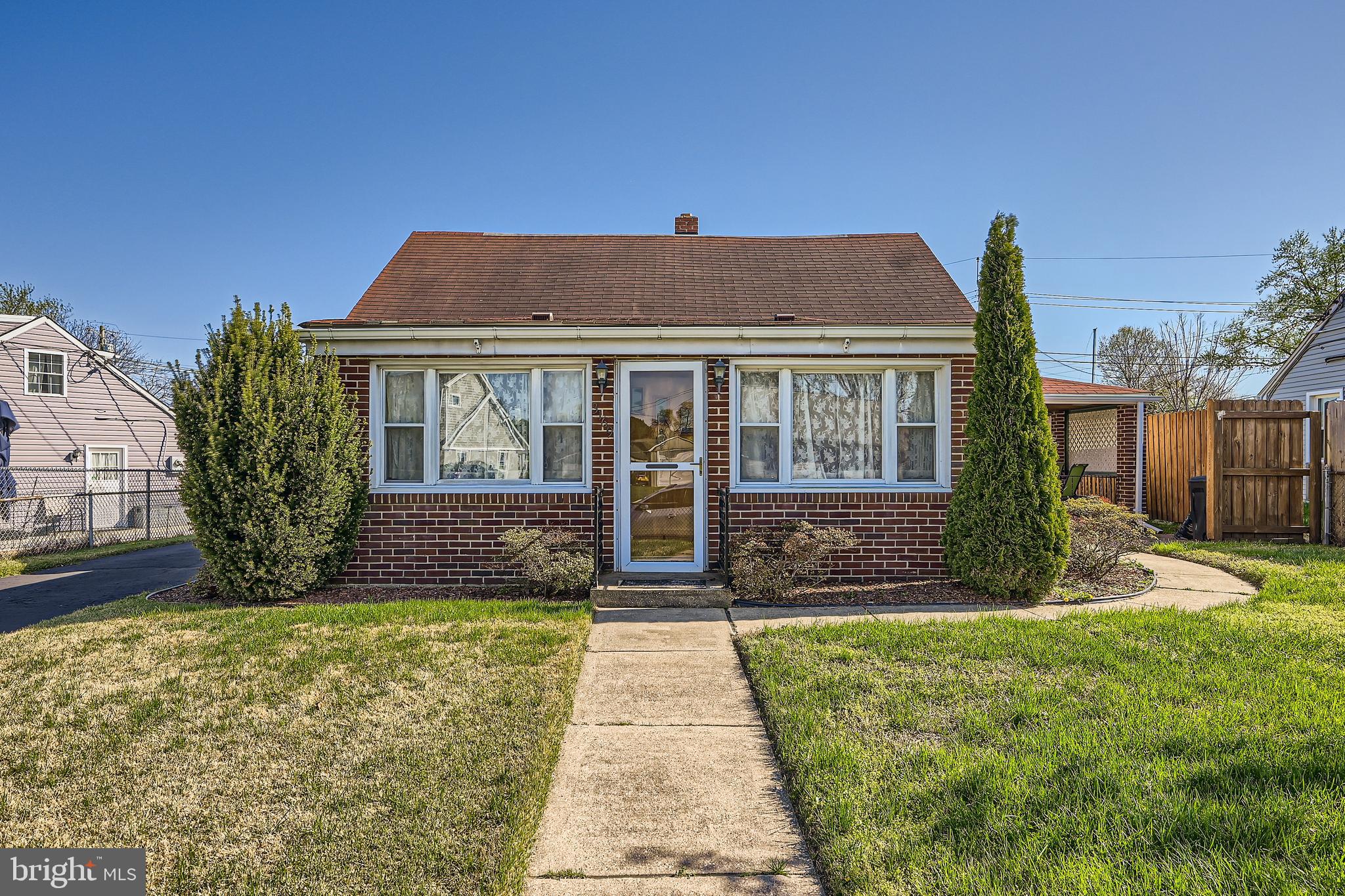 3169 Baybriar Road Baltimore, MD 21222 - Photo 4 of 28 a front view of a house with garden