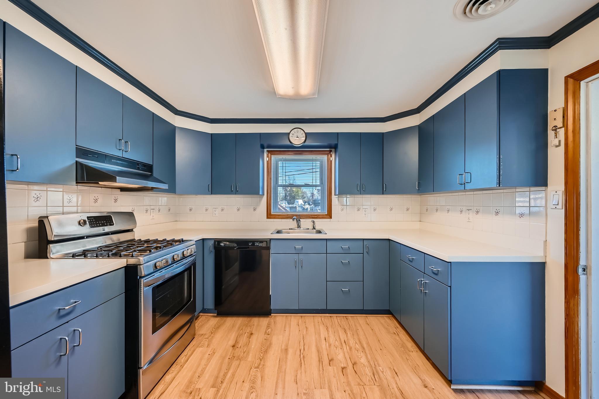 3169 Baybriar Road Baltimore, MD 21222 - Photo 9 of 28 a kitchen with stainless steel appliances granite countertop a sink stove and cabinets