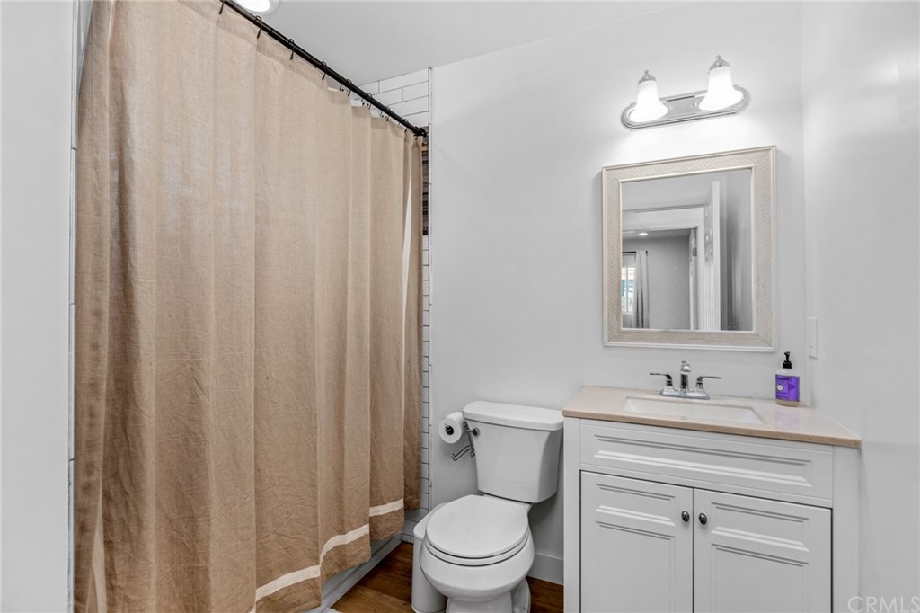 Undisclosed Address Costa Mesa, CA 92627 - Photo 11 of 15 a bathroom with a sink vanity mirror and toilet