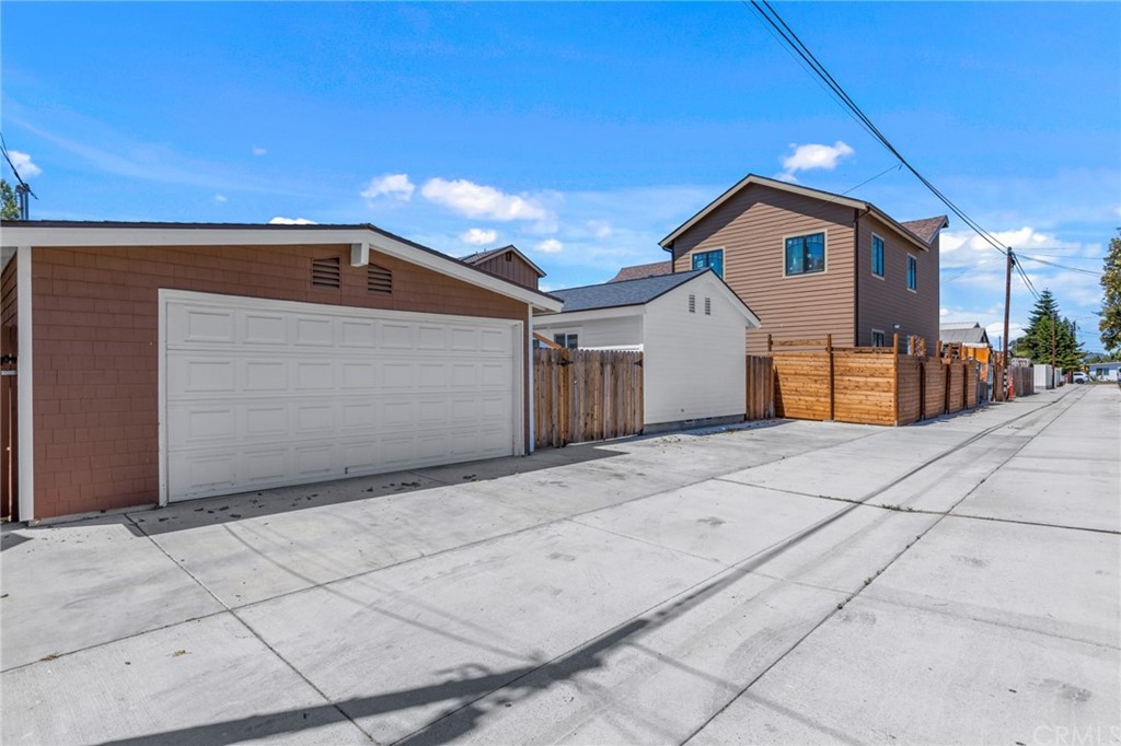 Undisclosed Address Costa Mesa, CA 92627 - Photo 15 of 15 a front view of a house with a yard