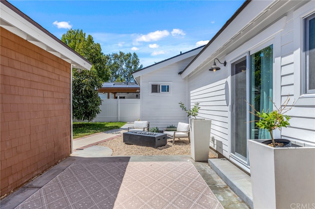 Undisclosed Address Costa Mesa, CA 92627 - Photo 2 of 15 a view of a patio with chairs and potted plants