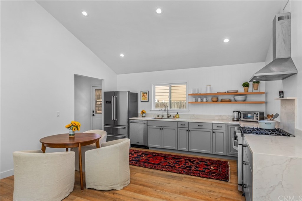 Undisclosed Address Costa Mesa, CA 92627 - Photo 6 of 15 a kitchen with stainless steel appliances granite countertop a sink stove and refrigerator