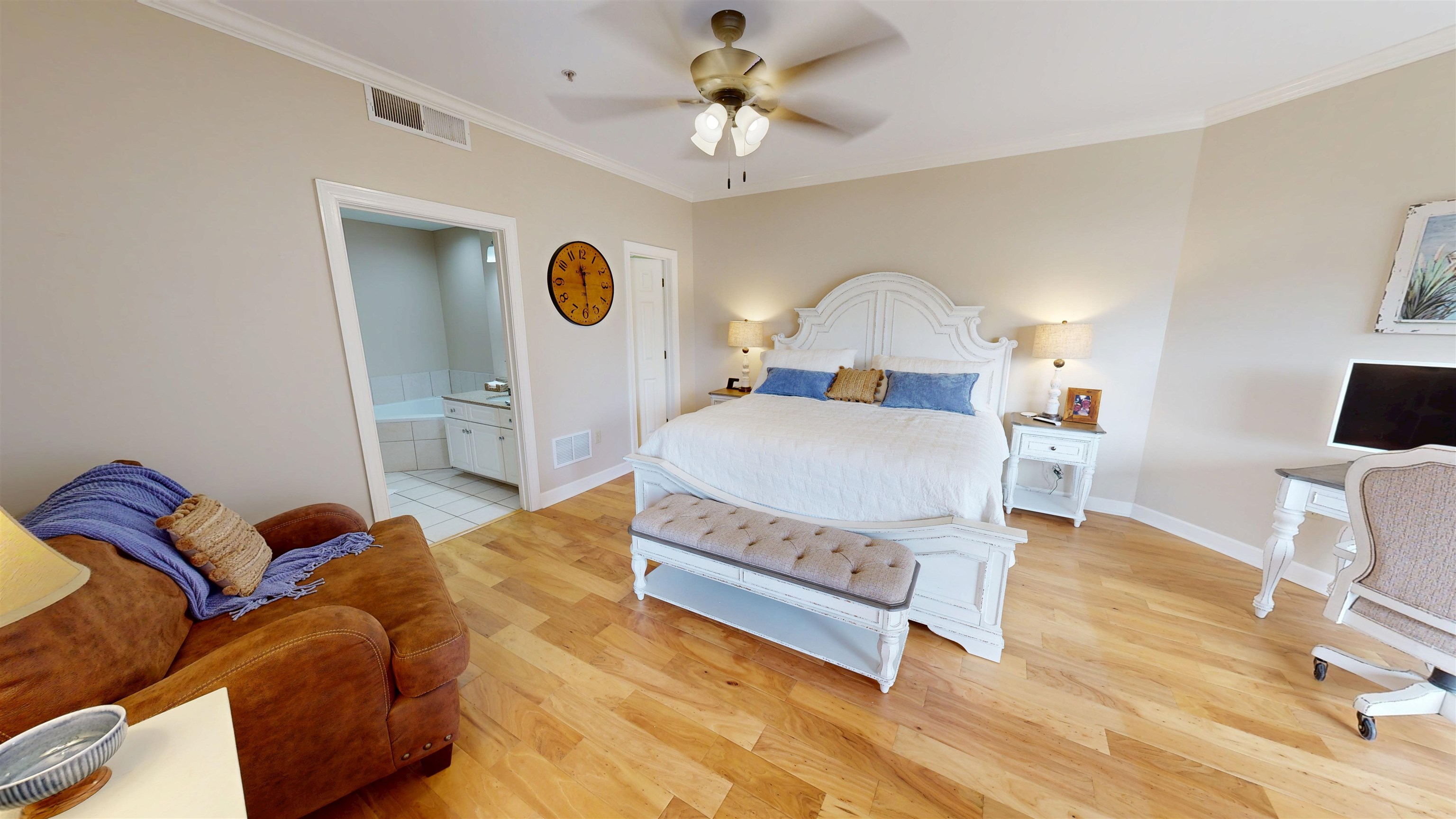 325 Cr 380 L-103 Road, Unit L103 Iuka, MS 38852 - Photo 18 of 40 Spacious interior featuring wood-finish flooring, crown molding, and a ceiling fan with integrated lighting