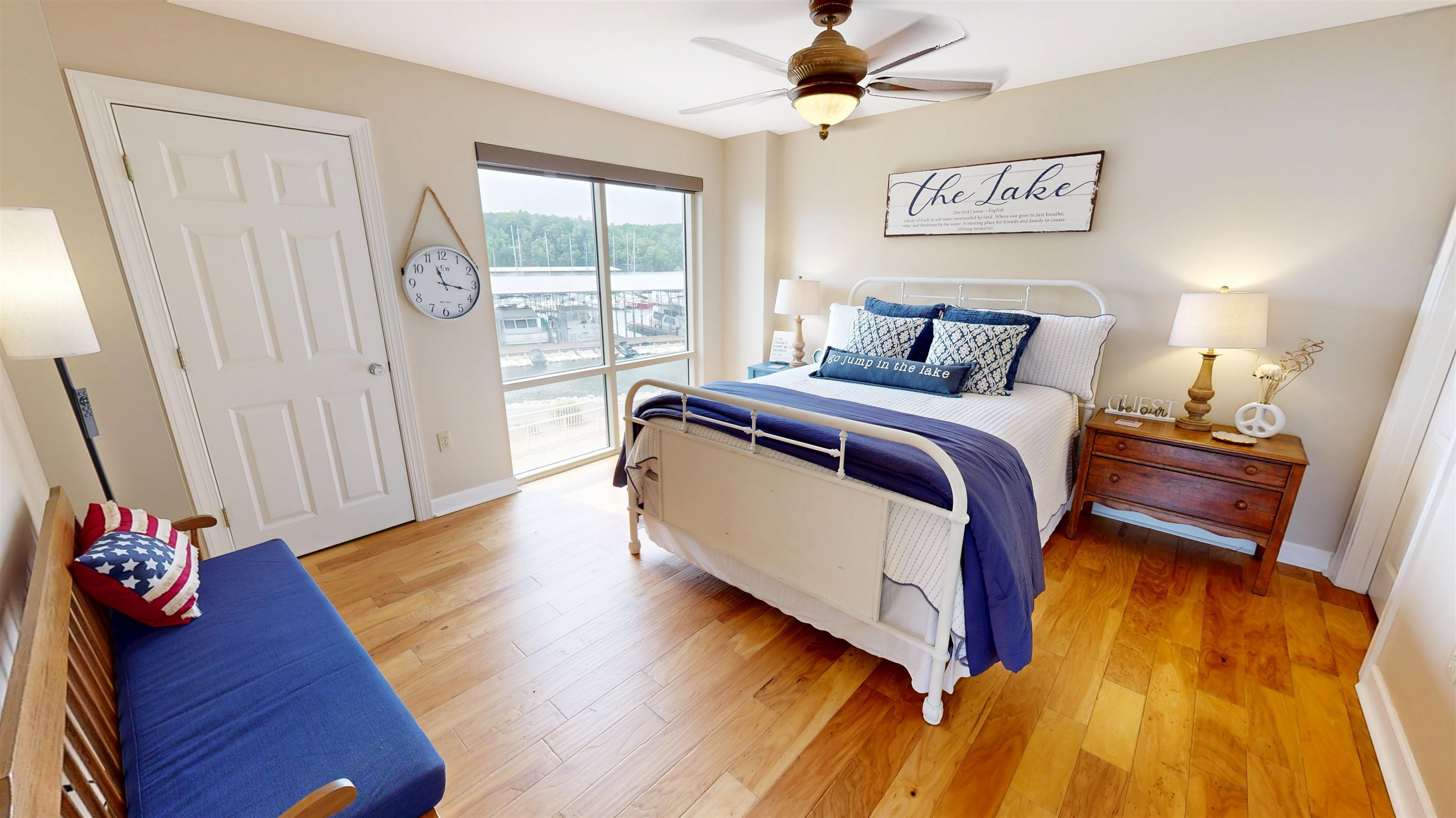 325 Cr 380 L-103 Road, Unit L103 Iuka, MS 38852 - Photo 24 of 40 Bedroom featuring wood-finish flooring, a ceiling fan with integrated lighting, and a window with a water view