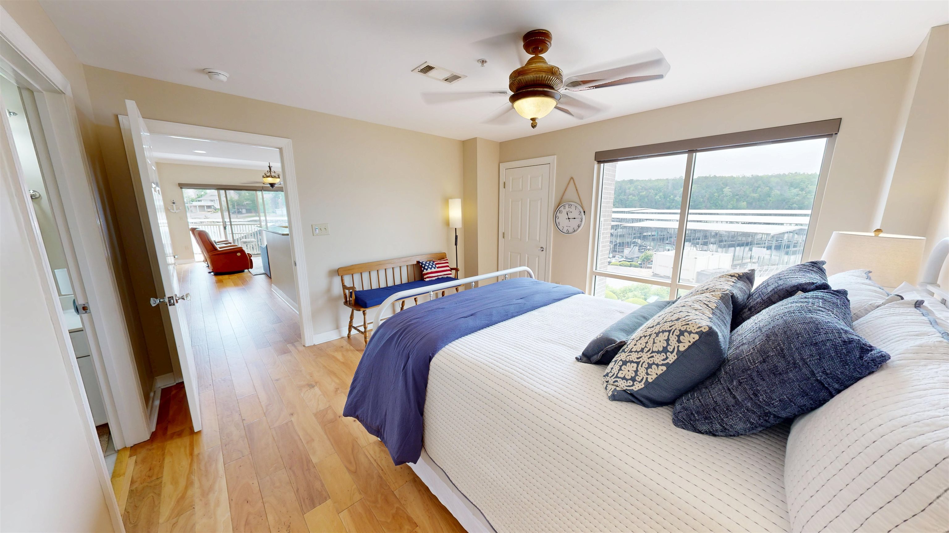 325 Cr 380 L-103 Road, Unit L103 Iuka, MS 38852 - Photo 26 of 40 Bedroom featuring wood-finish flooring, a ceiling fan with integrated lighting, and a large window
