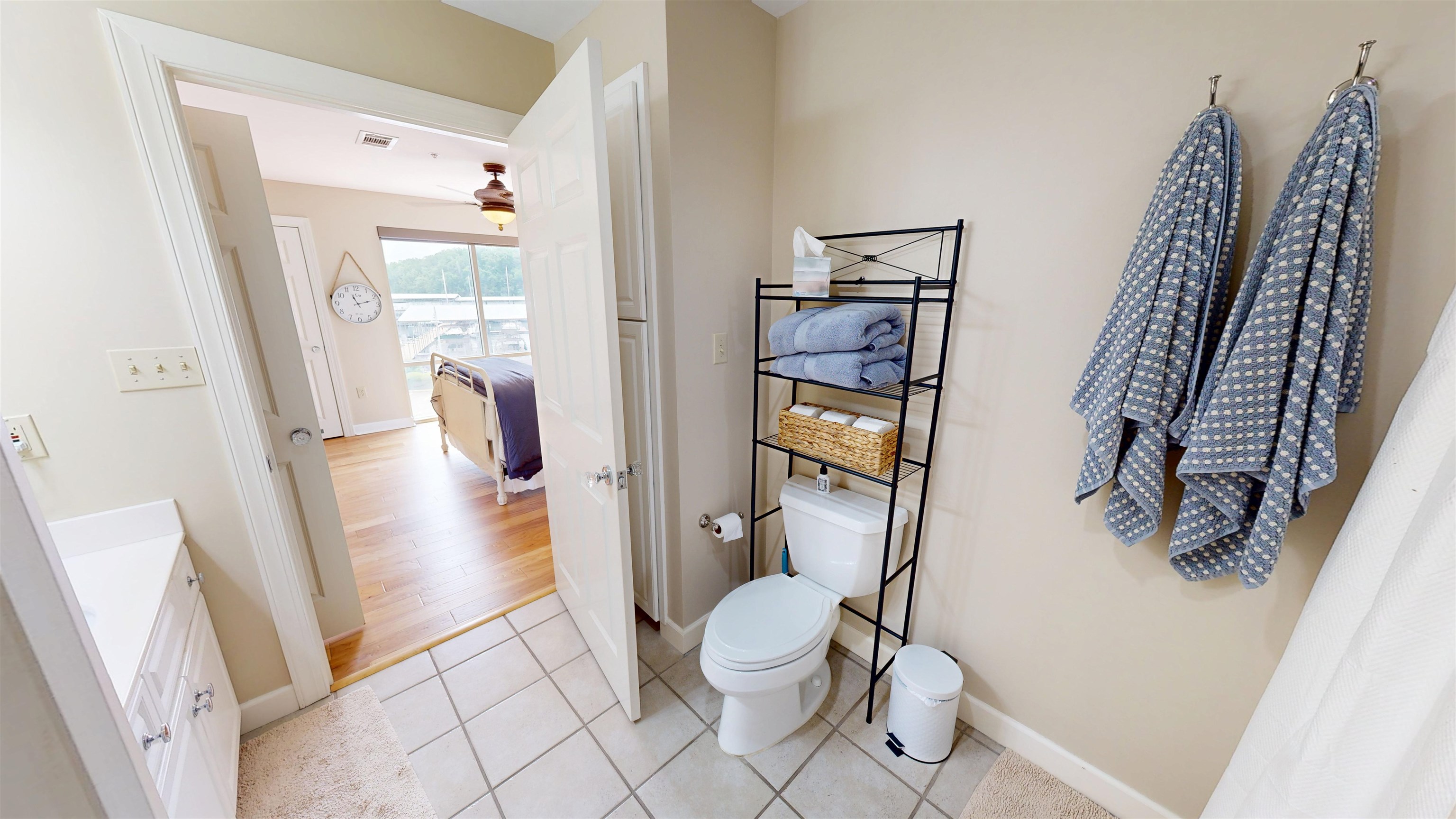 325 Cr 380 L-103 Road, Unit L103 Iuka, MS 38852 - Photo 27 of 40 Bathroom with light-toned tiled flooring and a white vanity with cabinet storage