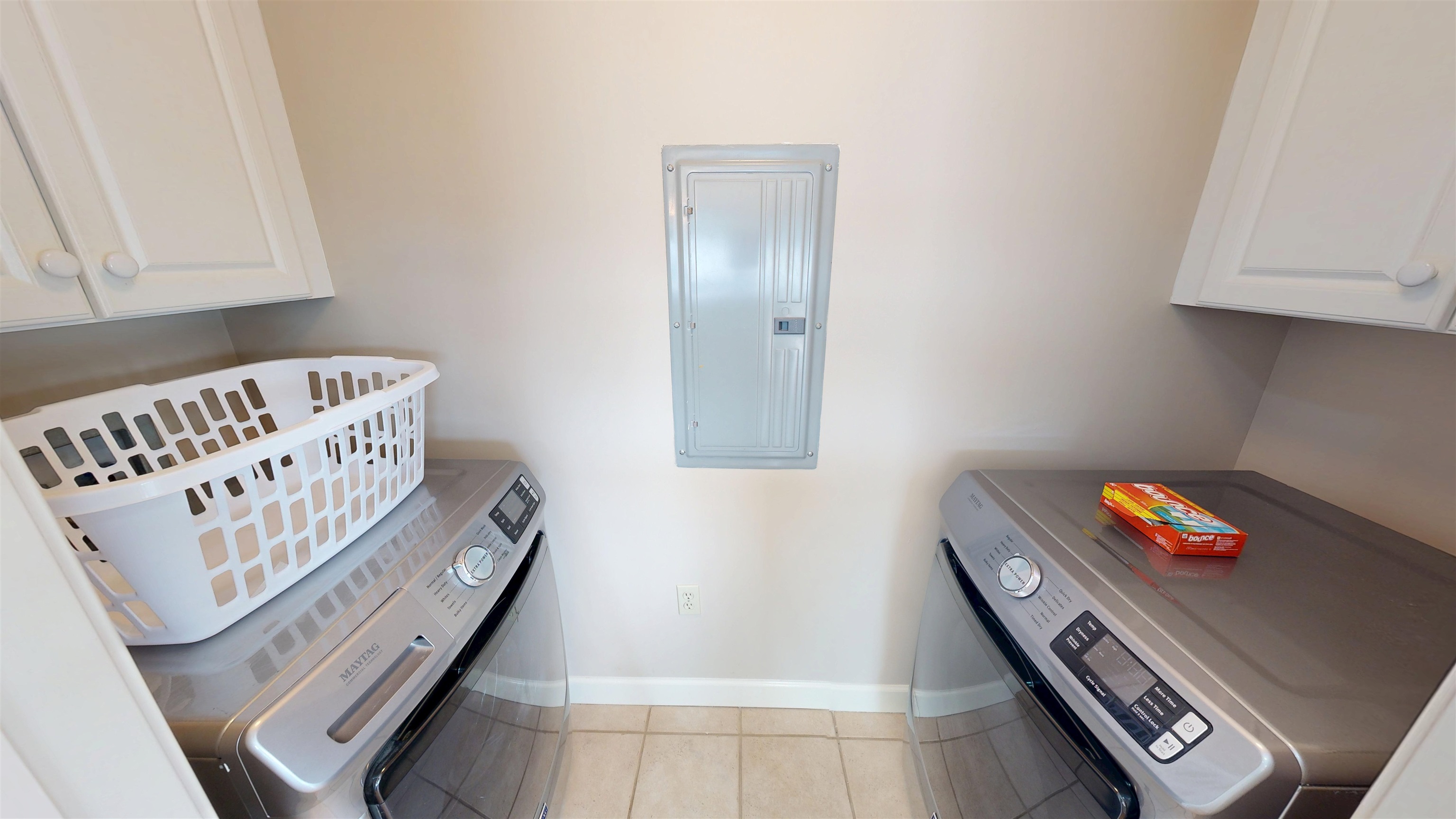 325 Cr 380 L-103 Road, Unit L103 Iuka, MS 38852 - Photo 29 of 40 Dedicated laundry area featuring tile flooring, upper cabinetry, and a neutral wall color