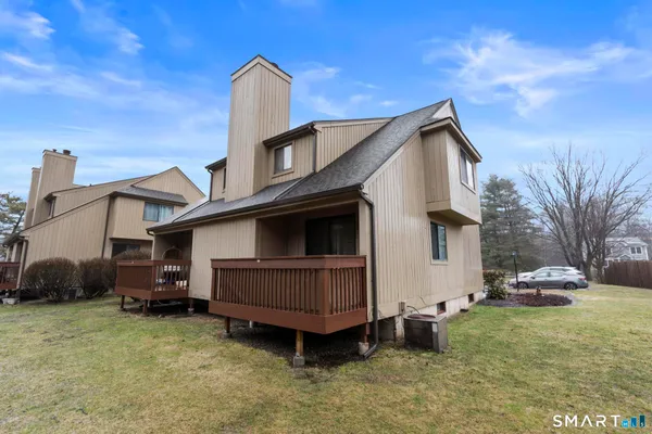 a view of a house with a back yard