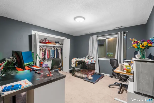 a view of a workspace with furniture and toys