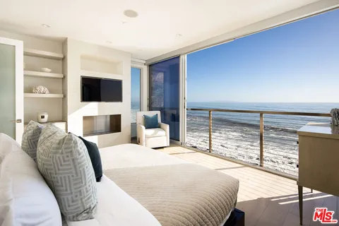 a front view of a house with yard and seating space