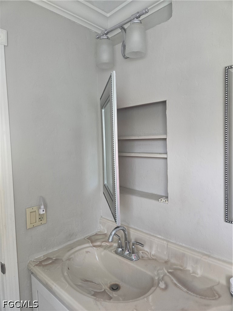 8093 Anhinga Road Fort Myers, FL 33967 - Photo 23 of 49 a bathroom with a sink and a large mirror