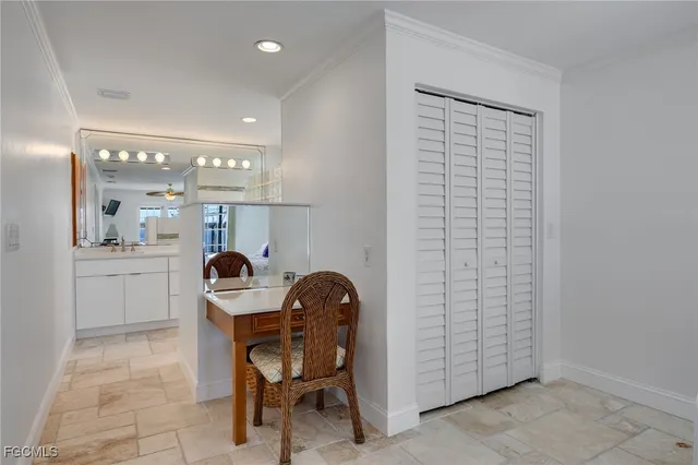 a dining room with furniture and bathroom view