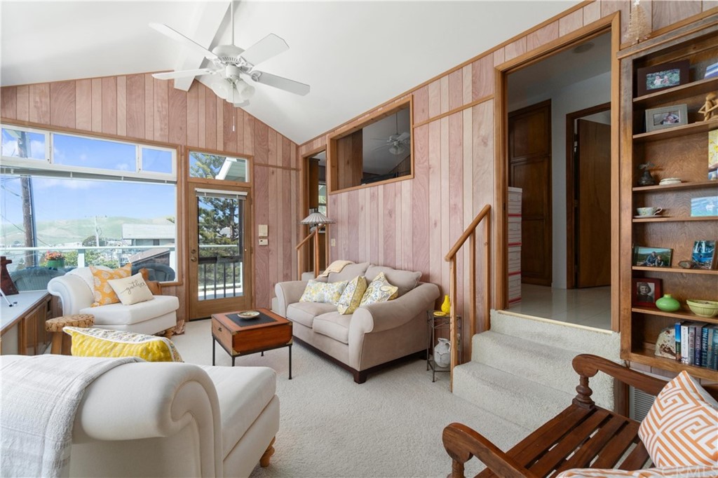 188 8th Street Cayucos, CA 93430 - Photo 13 of 33 a living room with furniture a rug and a chandelier