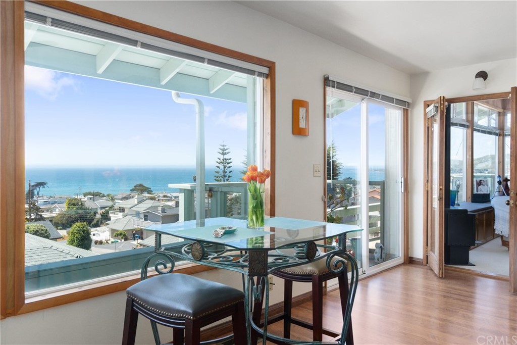 188 8th Street Cayucos, CA 93430 - Photo 16 of 33 a view of a dining room with furniture window and wooden floor