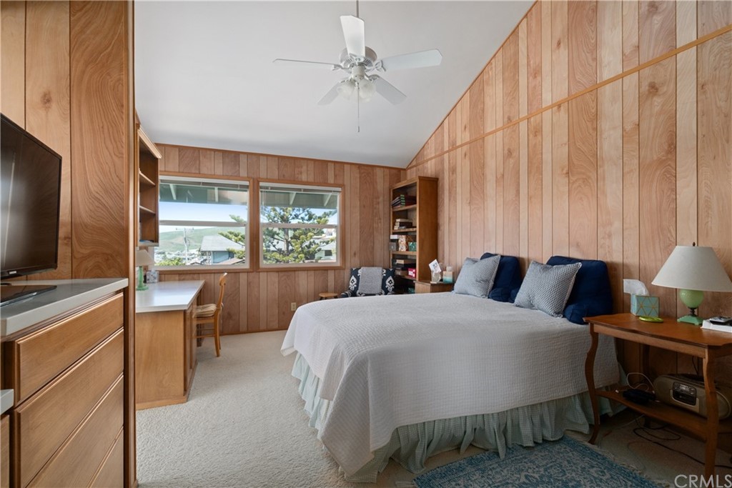 188 8th Street Cayucos, CA 93430 - Photo 18 of 33 a bedroom with a bed and a flat tv screen on dresser