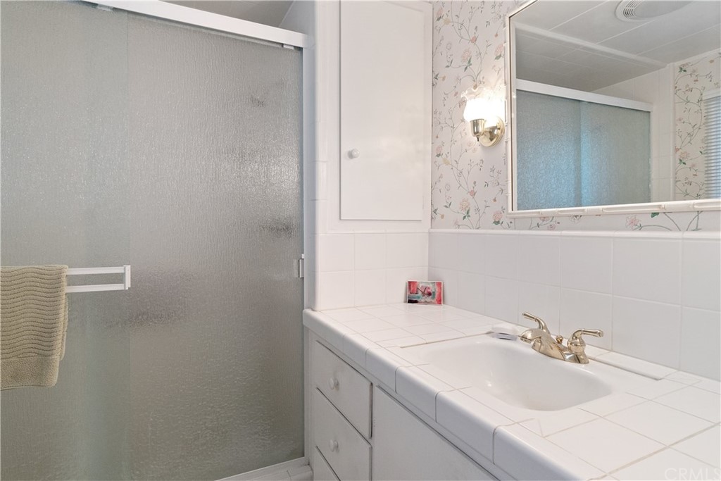 188 8th Street Cayucos, CA 93430 - Photo 29 of 33 a bathroom with a sink and a mirror