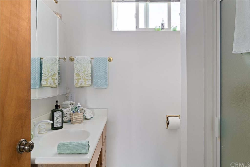 188 8th Street Cayucos, CA 93430 - Photo 32 of 33 a bathroom with a sink vanity and mirror