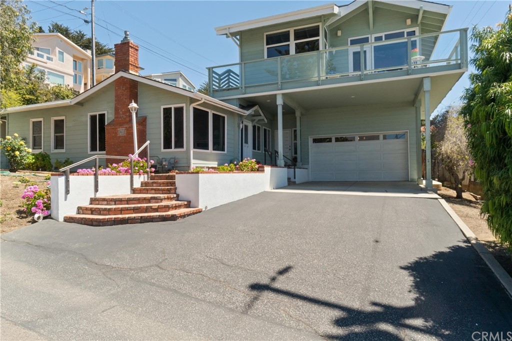 188 8th Street Cayucos, CA 93430 - Photo 33 of 33 a front view of a house with a yard table and chairs