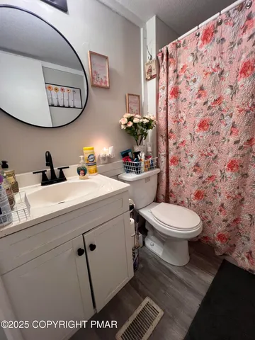 a view of a living room hardwood and hardwood floor
