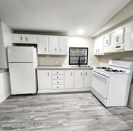 a view of kitchen and windows