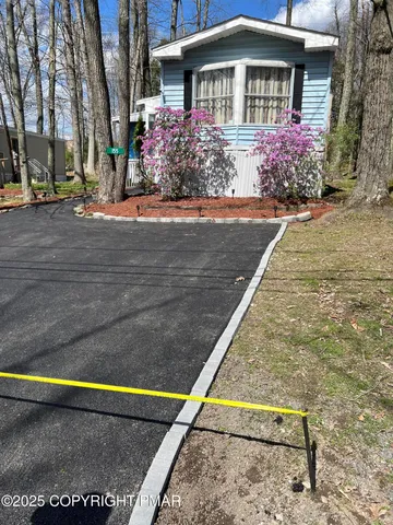 front view of a house with a small yard
