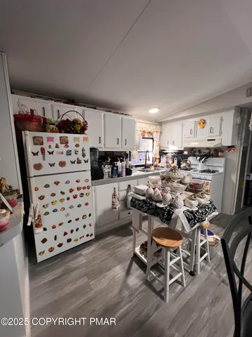 a view of a dining room kitchen and a window