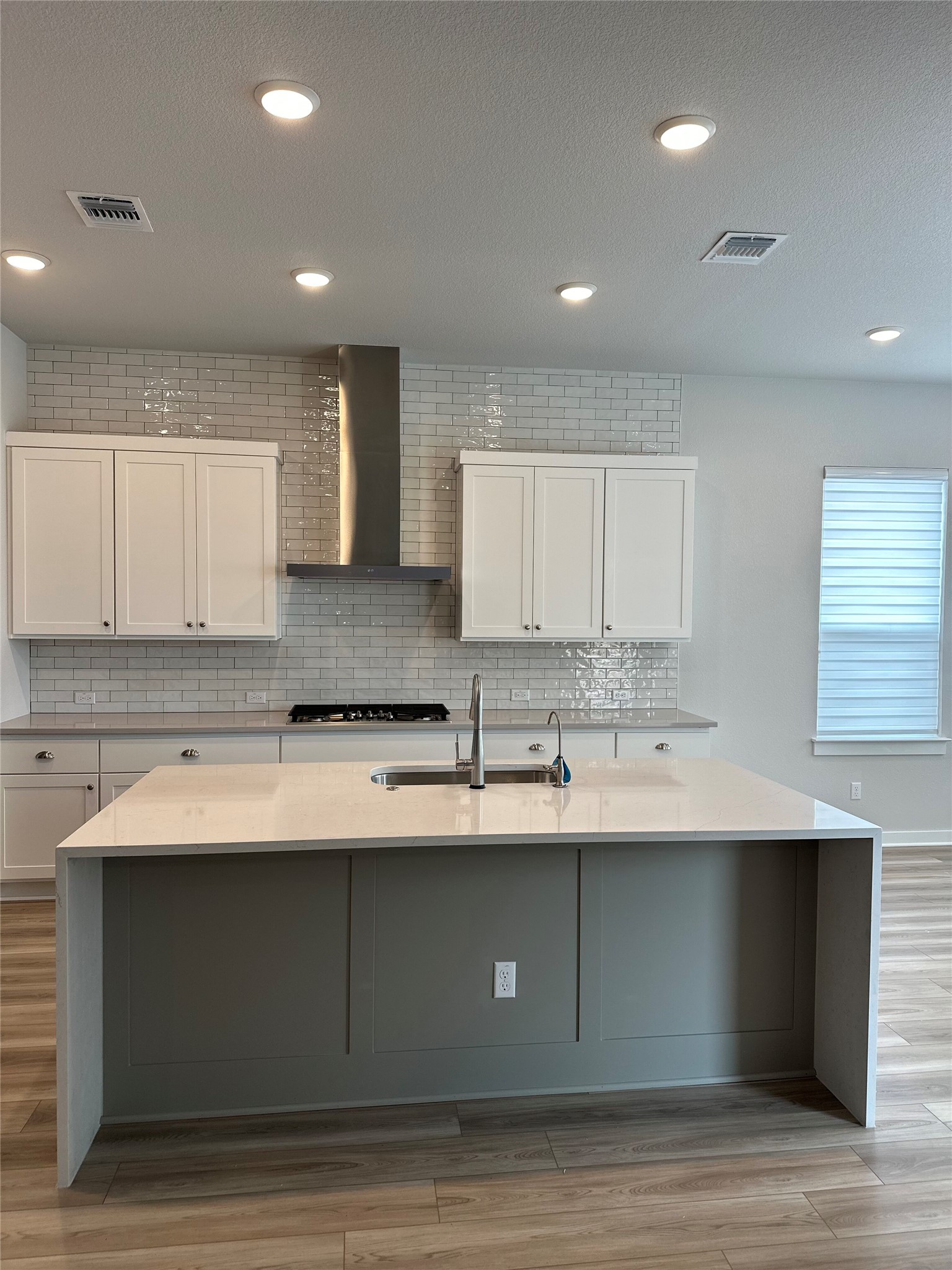 412 Lariat Loop Liberty Hill, TX 78642 - Photo 12 of 38 a kitchen with a sink cabinets and a window