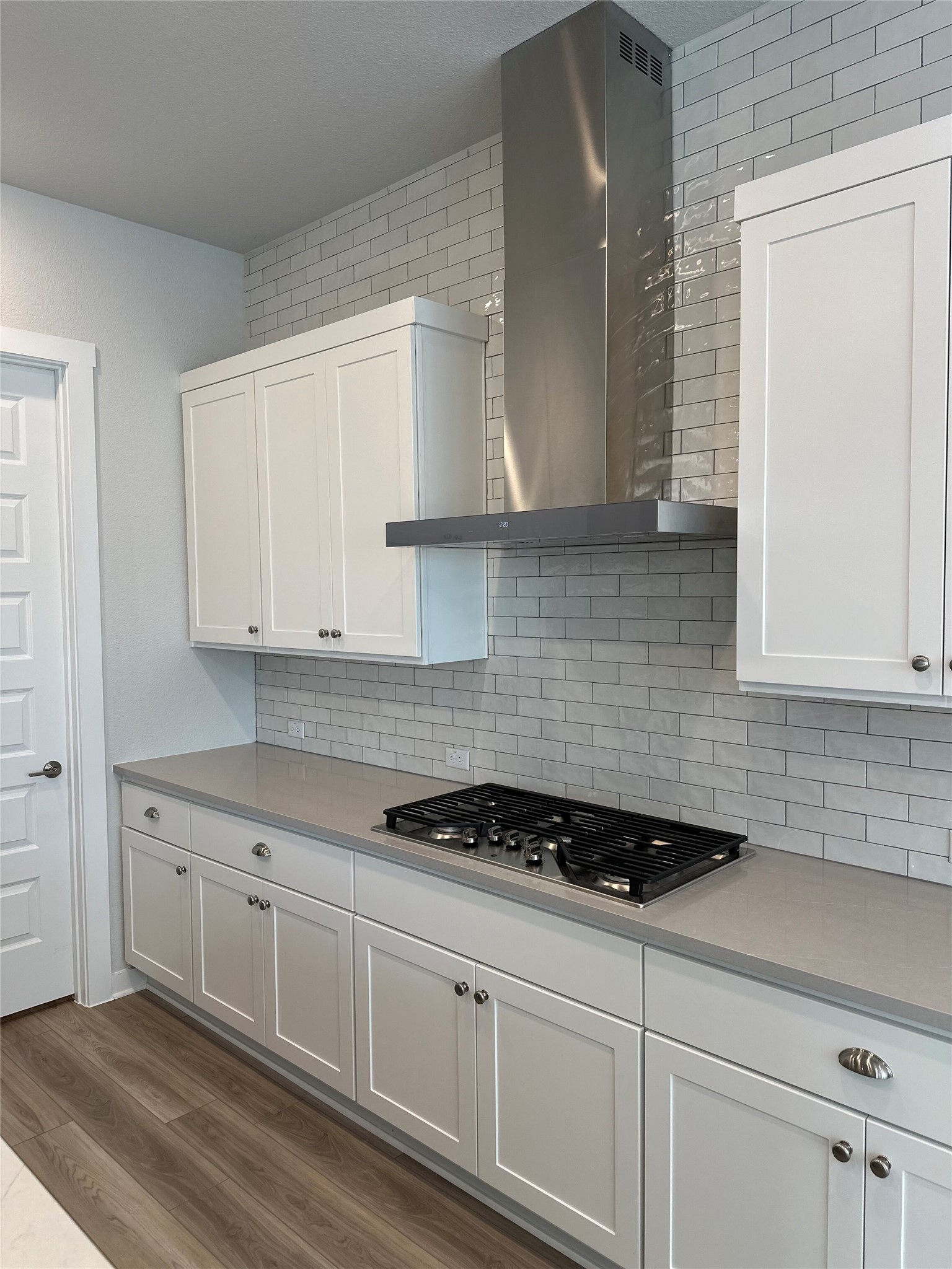 412 Lariat Loop Liberty Hill, TX 78642 - Photo 20 of 38 a kitchen with granite countertop white cabinets and white appliances
